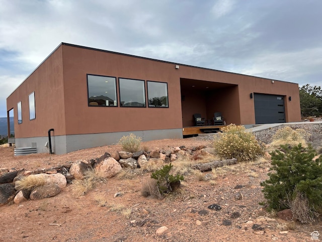 405 W 1000 N, Torrey, UT 84775 - view of front facade with stucco siding and a garage