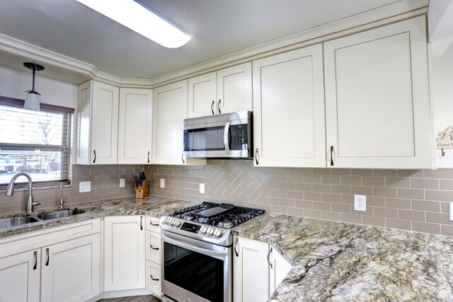 410 N 250 W, Springville, UT 84663 - kitchen with light stone countertops, a sink, backsplash, and appliances with stainless steel finishes