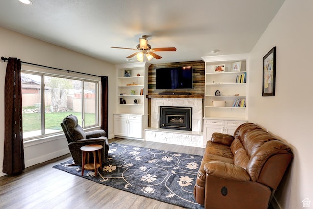 410 N 250 W, Springville, UT 84663 - living room with baseboards, a fireplace, wood finished floors, ceiling fan, and built in features