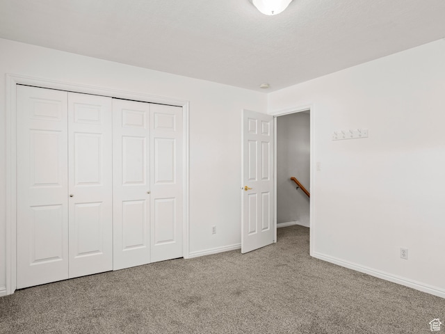 932 Independence Ave, Provo, UT 84604 - unfurnished bedroom featuring baseboards, a closet, and carpet floors