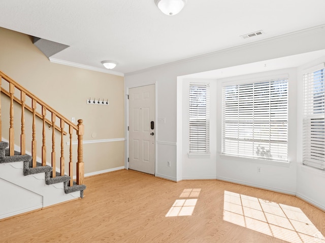 932 Independence Ave, Provo, UT 84604 - foyer entrance featuring crown molding, stairway, wood finished floors, baseboards, and visible vents