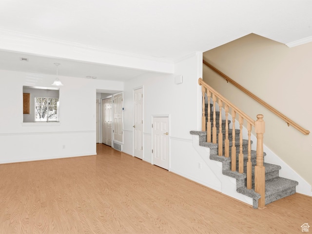 932 Independence Ave, Provo, UT 84604 - staircase featuring visible vents, wood finished floors, and ornamental molding