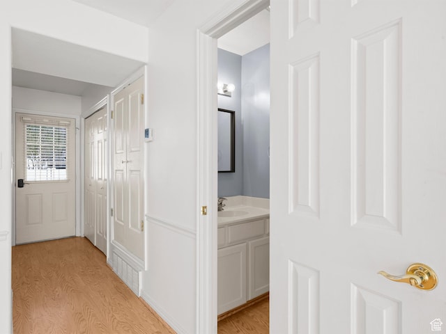 932 Independence Ave, Provo, UT 84604 - corridor with light wood-type flooring and a sink
