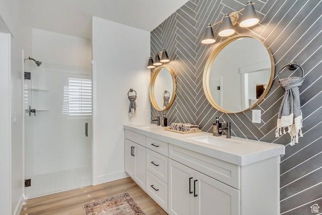 813 S 1260 W Unit 111, Heber City, UT 84032 - bathroom with double vanity, wood finished floors, a sink, and walk in shower