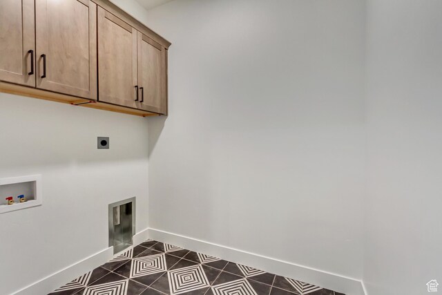 813 S 1260 W Unit 111, Heber City, UT 84032 - washroom with dark tile patterned floors, hookup for a washing machine, baseboards, electric dryer hookup, and cabinet space