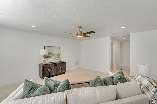 813 S 1260 W Unit 111, Heber City, UT 84032 - living room featuring a textured ceiling, visible vents, baseboards, ceiling fan, and light carpet