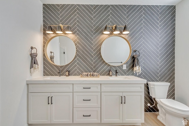 813 S 1260 W Unit 111, Heber City, UT 84032 - full bathroom featuring double vanity, toilet, tile walls, and a sink