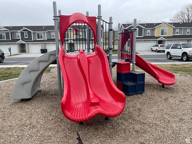 communal playground featuring a residential view