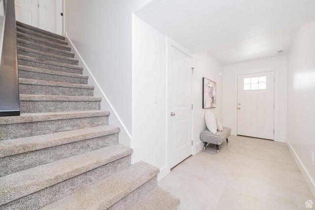 staircase with baseboards
