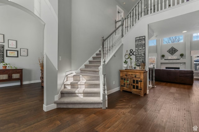 11773 S Twin Pines Ct, Draper, UT 84020 - stairway featuring baseboards, a high ceiling, and wood-type flooring