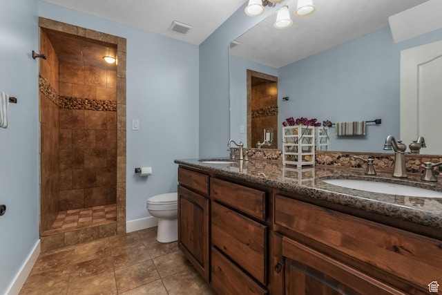 11773 S Twin Pines Ct, Draper, UT 84020 - full bath with visible vents, a sink, toilet, and tiled shower