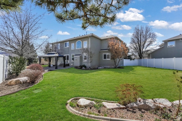 11773 S Twin Pines Ct, Draper, UT 84020 - rear view of property featuring a fenced backyard, a gazebo, stucco siding, and a yard