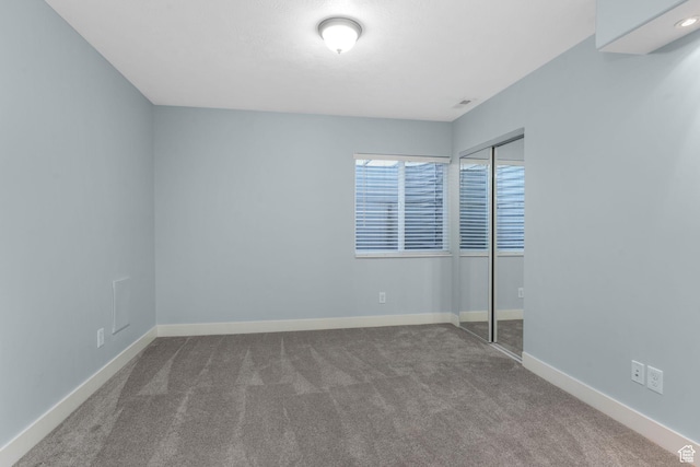 11773 S Twin Pines Ct, Draper, UT 84020 - unfurnished bedroom with baseboards, a closet, and carpet