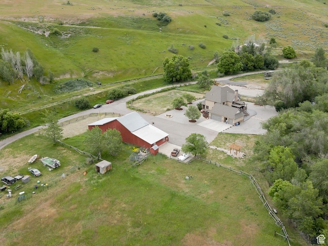 birds eye view of property with a rural view