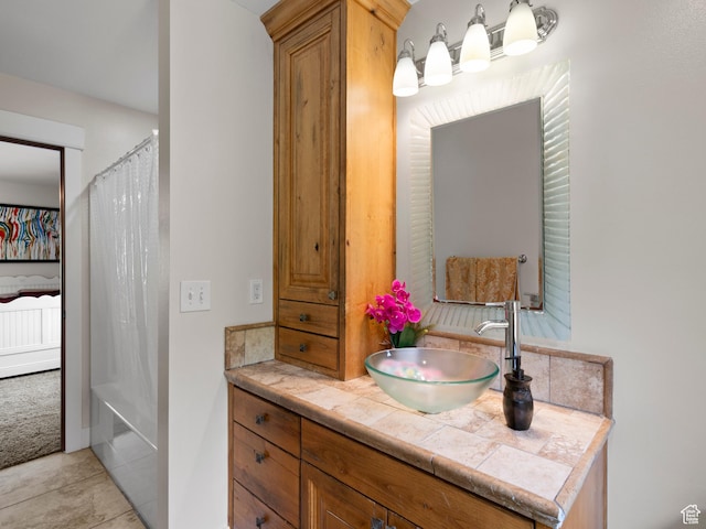 bathroom featuring tile patterned floors and vanity