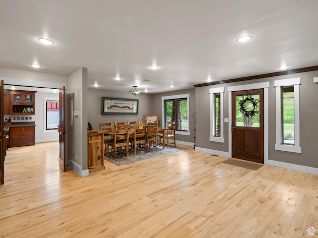 entryway featuring recessed lighting, light wood-style flooring, and baseboards