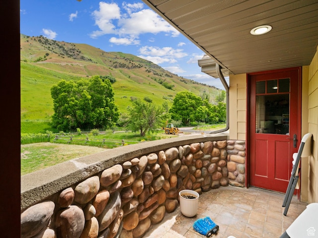 balcony featuring a mountain view