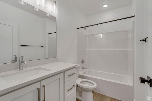 8077 N Bristle Cone Rd, Eagle Mountain, UT 84005 - full bath with bathtub / shower combination, wood finished floors, toilet, and vanity