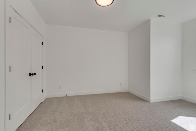 8077 N Bristle Cone Rd, Eagle Mountain, UT 84005 - unfurnished bedroom featuring light carpet, baseboards, and visible vents