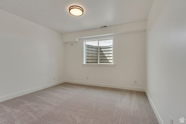 8077 N Bristle Cone Rd, Eagle Mountain, UT 84005 - spare room featuring baseboards, visible vents, and light carpet