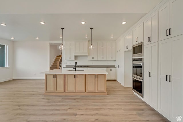 8077 N Bristle Cone Rd, Eagle Mountain, UT 84005 - kitchen featuring light wood-style flooring, appliances with stainless steel finishes, and recessed lighting