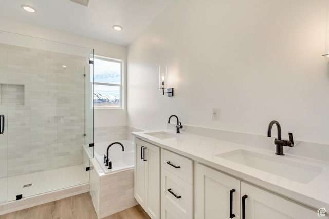 8077 N Bristle Cone Rd, Eagle Mountain, UT 84005 - full bathroom with a shower stall, a bath, wood finished floors, and a sink