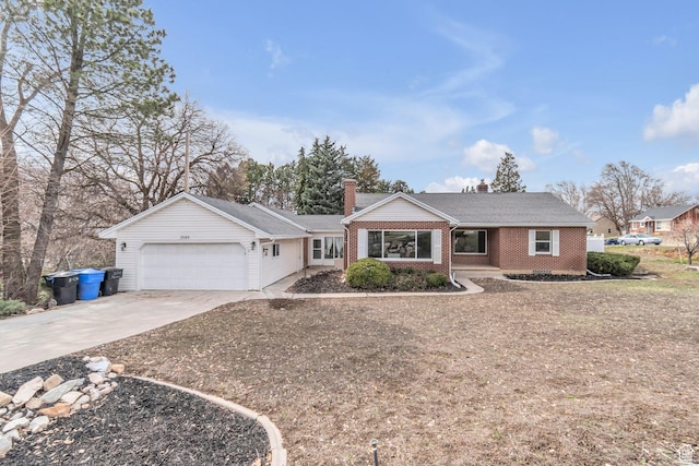 ranch-style home featuring brick siding, driveway, an attached garage, and a chimney
