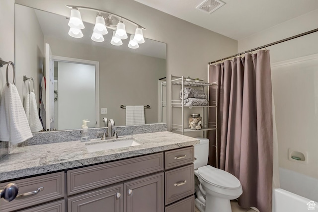 bathroom with shower / bath combo with shower curtain, visible vents, toilet, and vanity
