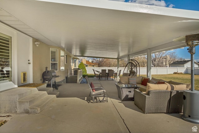 view of patio with a fenced backyard, grilling area, outdoor dining area, and outdoor lounge area