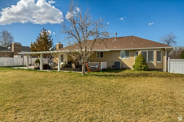 rear view of house with central AC, a fenced backyard, a lawn, a pergola, and a patio area
