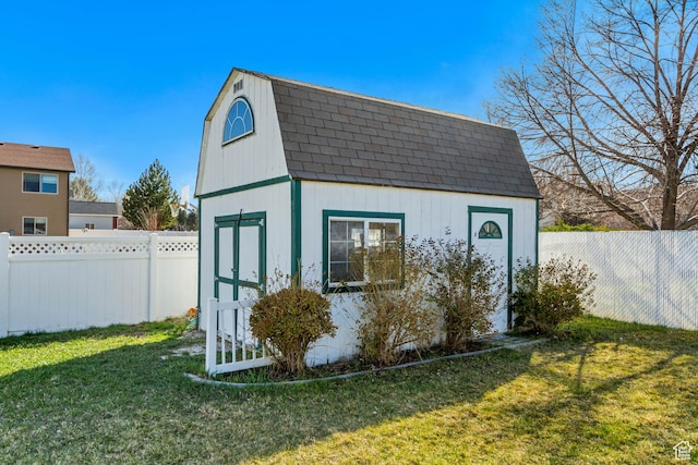 view of shed featuring a fenced backyard