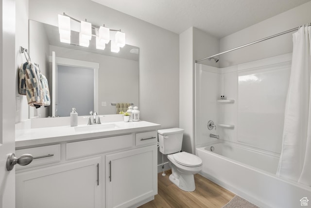 bathroom with shower / bath combination with curtain, wood finished floors, toilet, and vanity