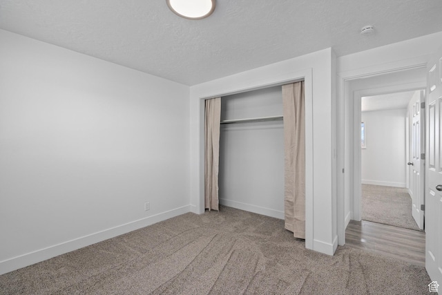 252 W Durfee St, Grantsville, UT 84029 - unfurnished bedroom featuring carpet floors, baseboards, a closet, and a textured ceiling