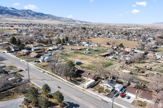 252 W Durfee St, Grantsville, UT 84029 - aerial view of property and surrounding area featuring a mountain backdrop and nearby suburban area