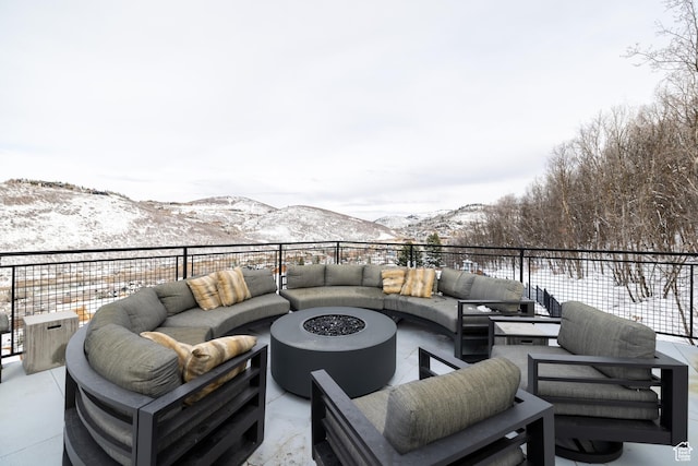 1271 Lowell Ave Unit D201, Park City, UT 84060 - snow covered patio with an outdoor living space with a fire pit and a mountain view