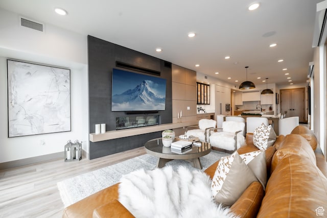 1271 Lowell Ave Unit D201, Park City, UT 84060 - living room with light wood finished floors and recessed lighting