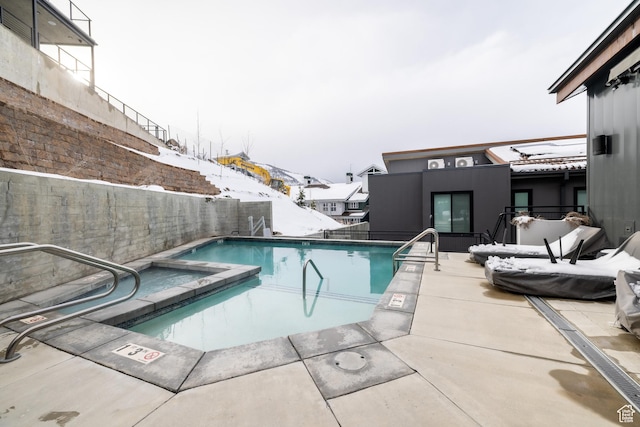 1271 Lowell Ave Unit D201, Park City, UT 84060 - view of swimming pool featuring a patio, a pool with connected hot tub, and a fenced backyard
