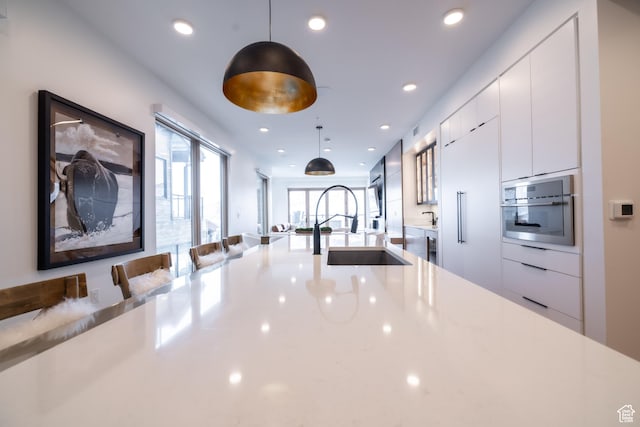 1271 Lowell Ave Unit D201, Park City, UT 84060 - kitchen featuring modern cabinets, white cabinetry, pendant lighting, recessed lighting, and oven