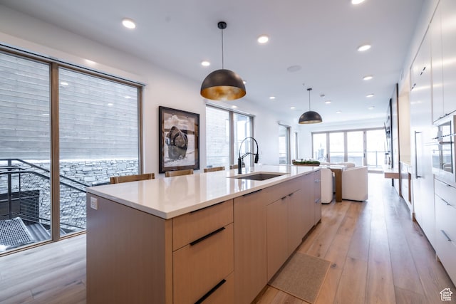 1271 Lowell Ave Unit D201, Park City, UT 84060 - kitchen with modern cabinets, open floor plan, light countertops, light wood-style flooring, and recessed lighting