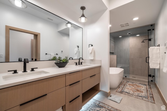 1271 Lowell Ave Unit D201, Park City, UT 84060 - bathroom featuring double vanity, a stall shower, a freestanding bath, and recessed lighting