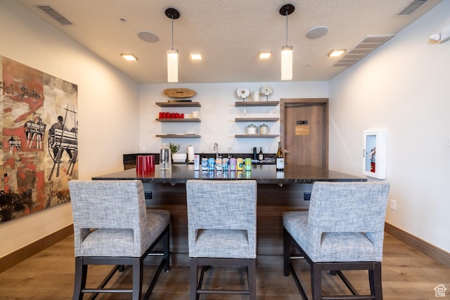 1271 Lowell Ave Unit D201, Park City, UT 84060 - community bar area featuring dark wood-style flooring and decorative light fixtures