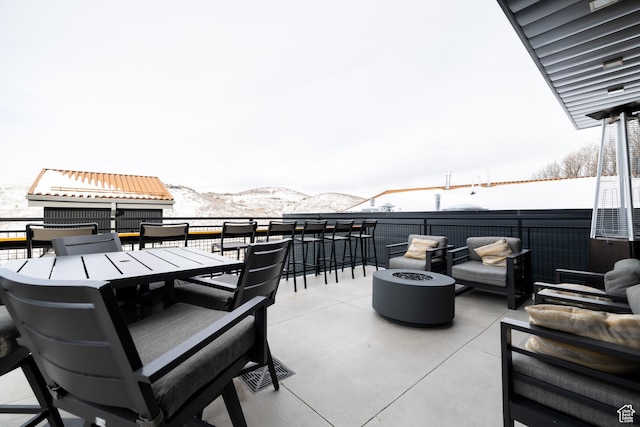 1271 Lowell Ave Unit D201, Park City, UT 84060 - view of patio with an outdoor living space with a fire pit, a mountain view, and outdoor dining area