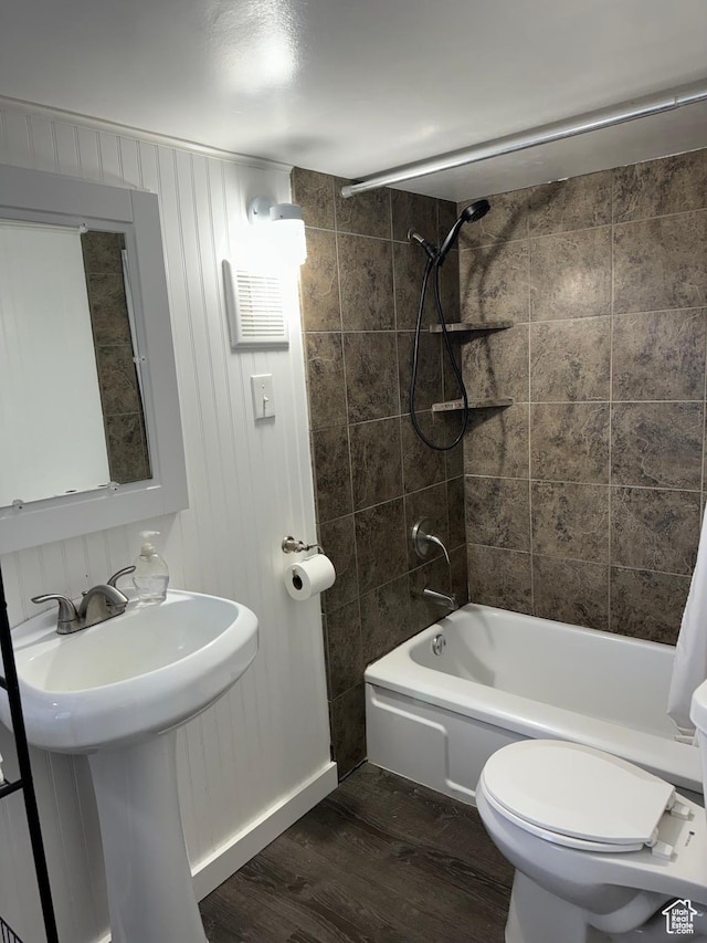 55 W Main St, Grantsville, UT 84029 - bathroom featuring wood finished floors, toilet, and bathing tub / shower combination
