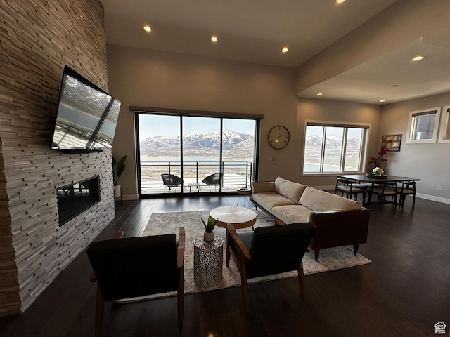 818 E Miner Way Unit 34, Hideout, UT 84036 - living room with baseboards, a fireplace, wood finished floors, and recessed lighting