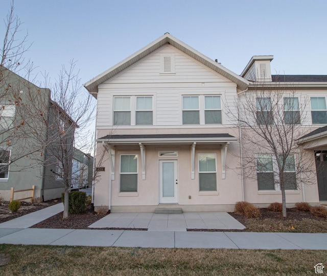 view of front of house featuring stucco siding