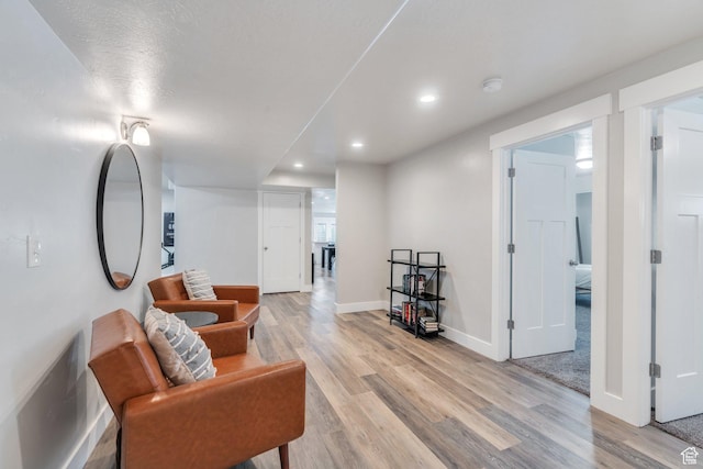 9844 N Faust Station Dr W, Eagle Mountain, UT 84005 - living area featuring baseboards, light wood-type flooring, and recessed lighting