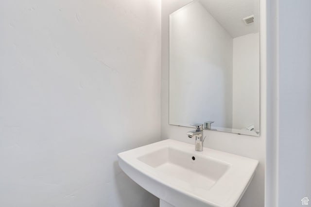 9844 N Faust Station Dr W, Eagle Mountain, UT 84005 - bathroom featuring visible vents and a sink