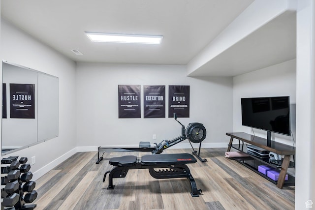 9844 N Faust Station Dr W, Eagle Mountain, UT 84005 - workout room featuring baseboards, visible vents, and wood finished floors