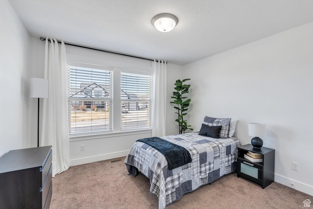 9844 N Faust Station Dr W, Eagle Mountain, UT 84005 - bedroom featuring light carpet and baseboards
