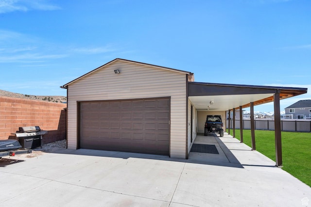 9844 N Faust Station Dr W, Eagle Mountain, UT 84005 - garage with fence and concrete driveway